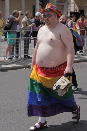gay-rainbow-flag-portrait-manwith-naked-torso-wearing-below-waist-lesbian-pride-parade-london-...jpg