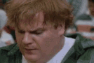 chris-farley-smirk.gif
