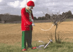 clown-watering-plant.gif