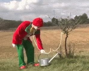 clown-watering-the-plant.gif