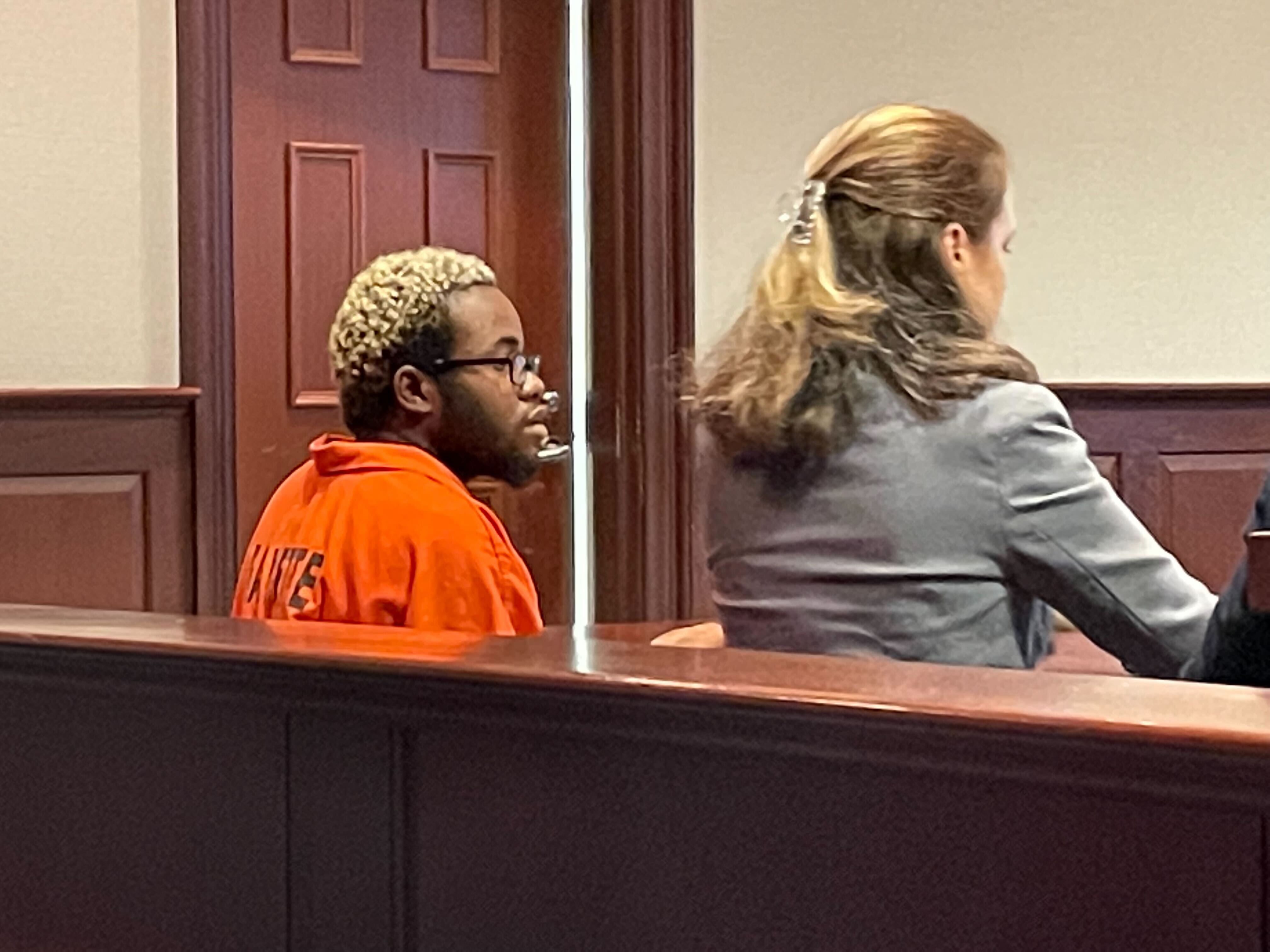 Xavier Rushin, a member of the Black Hammer Party, listens in Fayette County Magistrate Court on Tuesday. He and another member of the group are charged with multiple felonies stemming from an alleged kidnapping and sexual assault at the group's communal home in Fayetteville. Rushin is known within the group as Keno. (Chris Joyner/AJC)